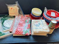 Group shot showing all tableware items including plates, bowls, napkins, cups and tablecover