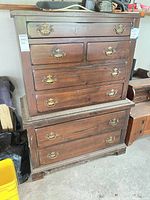 Front view of dresser showing all seven drawers and hardware