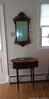 Mirror and table together against wall