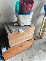 Stacked wooden crates with plastic containers on top