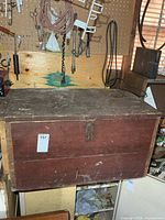 Closed wooden tool chest front view showing exterior condition