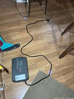 UPS laying on floor showing full length and power cord