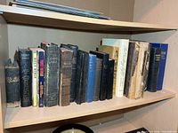 Entire third shelf showing full run of Bibles