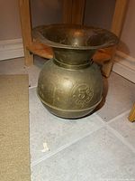 Full view of brass spittoon showing overall form and size