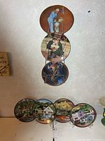 Full view of seven plates: three in rack, four on stands
