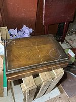 closed wooden chest on stool