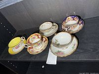 Group shot of all five teacup and saucer sets