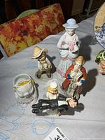 Group shot of all figurines and planter