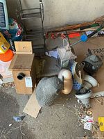 Lot overview showing owl, birdhouse, rack, lantern, insulators, finial