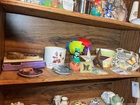 Full view of third shelf showing assorted decor items