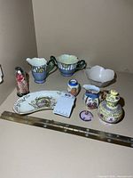 Group shot of all nine porcelain items laid out