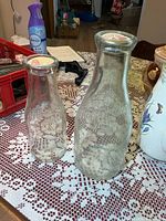 Quart and pint Roblin Dairy Belleville glass milk bottles on table