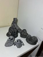 Group shot all stone animal sculptures