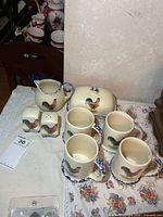 Full set showing mugs, shakers, butter dish, creamer