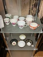 Two-shelf view showing majority of cups