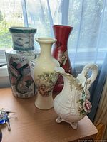 All four vases together on table