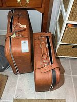 Two brown Jet Stream suitcases side by side showing size difference