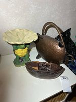Group shot of watering can, turtle figure, and wooden Ark