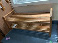 Full view of two-tier wooden rack on countertop