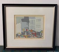 full view of framed artwork showing frame, mat, and print