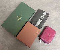 Group shot of all wallets and boxes