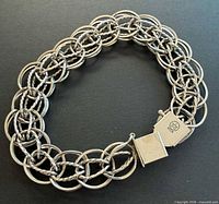 Full bracelet laid flat showing woven link pattern