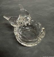 Oblique view of entire crystal birdbath figurine