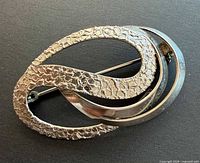 Front view showing textured and polished sterling silver loops