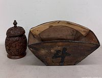 Canister and basket side by side showing overall forms and relative sizes