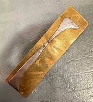 Front view showing gold base and silver accent