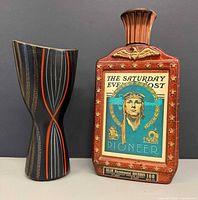 Front view of both the Jim Beam decanter and West German vase