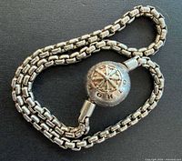 Bracelet coiled showing chain and ball clasp