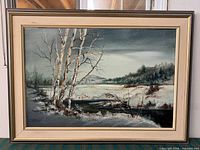 full view of framed winter landscape painting