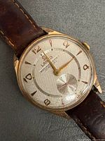 Close-up of Lanco dial showing branding, hands, numerals, sub-seconds