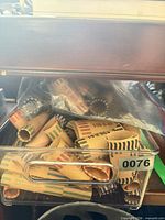 clear bin filled with assorted paper coin wrappers