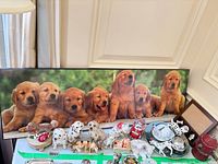 Overview of lot with canvas print and assorted dog figurines