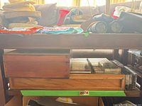 Overall lot showing wooden rack and box with tapes