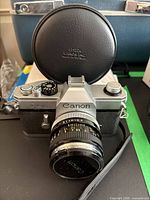 Front view of Canon TLb with 50mm lens and Leica Canada case