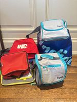 Group view of multiple soft coolers and lunch bags