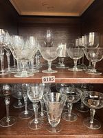 Cabinet shelf with multiple etched crystal stemware types