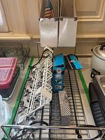 overall lot showing hangers, wire shelf, food containers, magazine holders and sewing machine box