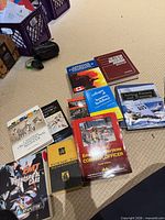Group shot of books on carpet, showing majority of titles