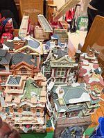 Overhead view of multiple ceramic firehouse village buildings with cords