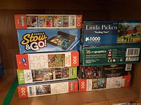 Overall view of stacked puzzle boxes on shelf
