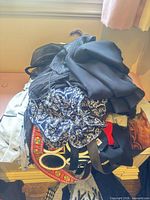 Stack of assorted scarves showing prints and solids
