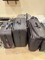 Three suitcases side by side front view
