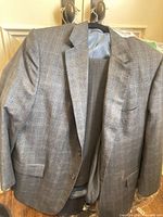 Grey suit jacket on hanger