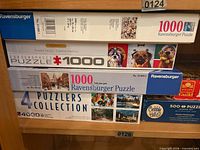 Stack showing Ravensburger, Eurographics, 4-Puzzle Collection boxes