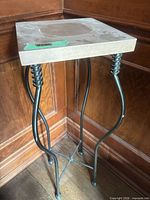 Full view of side table showing legs and top