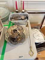 Overall lot showing chamberstick, snuffer, flatware tray, candleholders